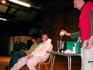 The 3 volunteers for the Zombie Make Up Demo look frightened by the litre of Golden Syrup...